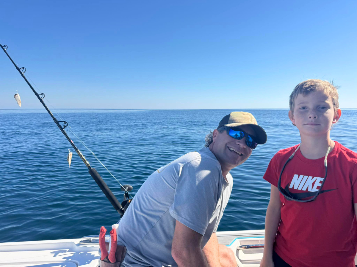 first mate Brannon House with his son on offshore fishing trip out of fort morgan