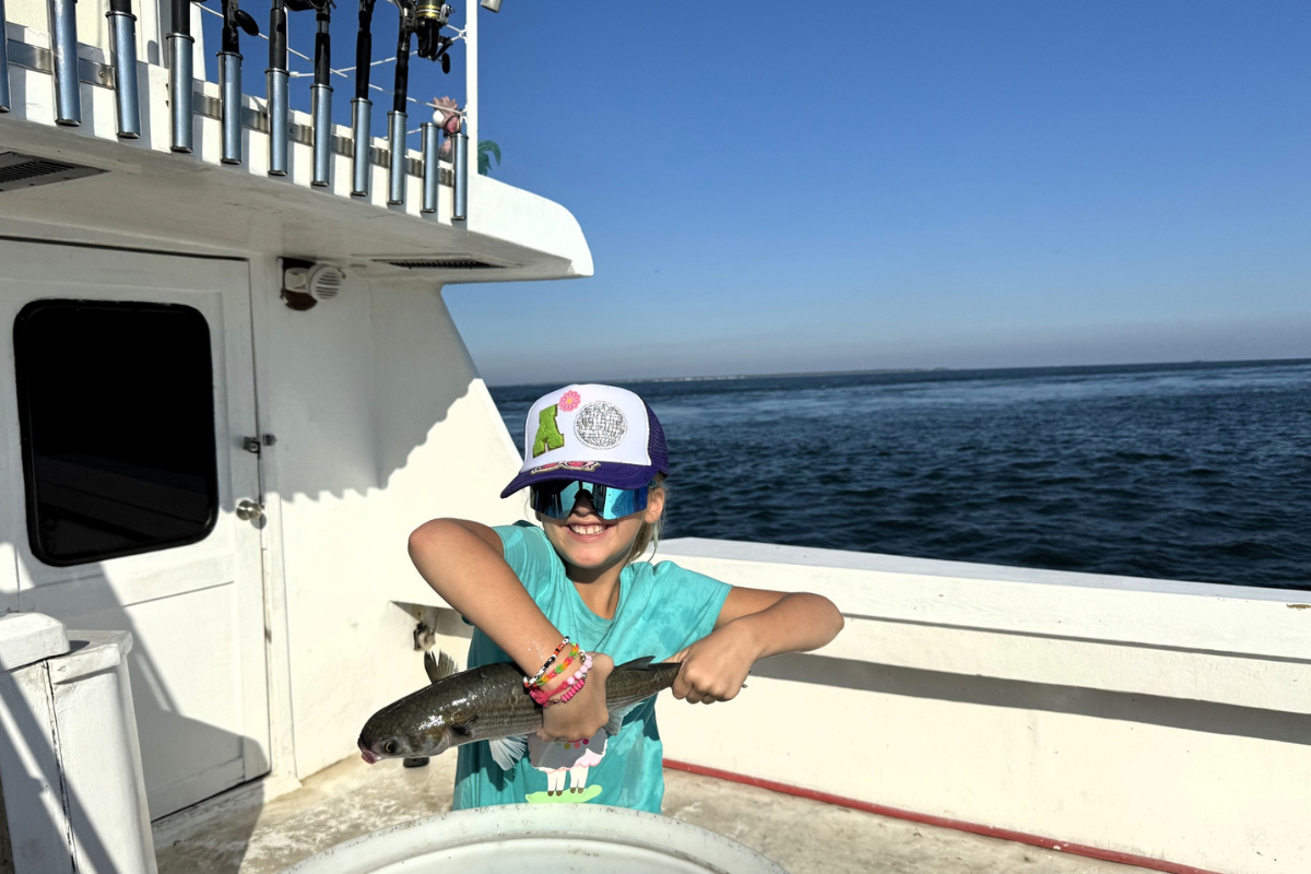 ava newton hanging out with fish on offshore fishing trip on the No Doubt