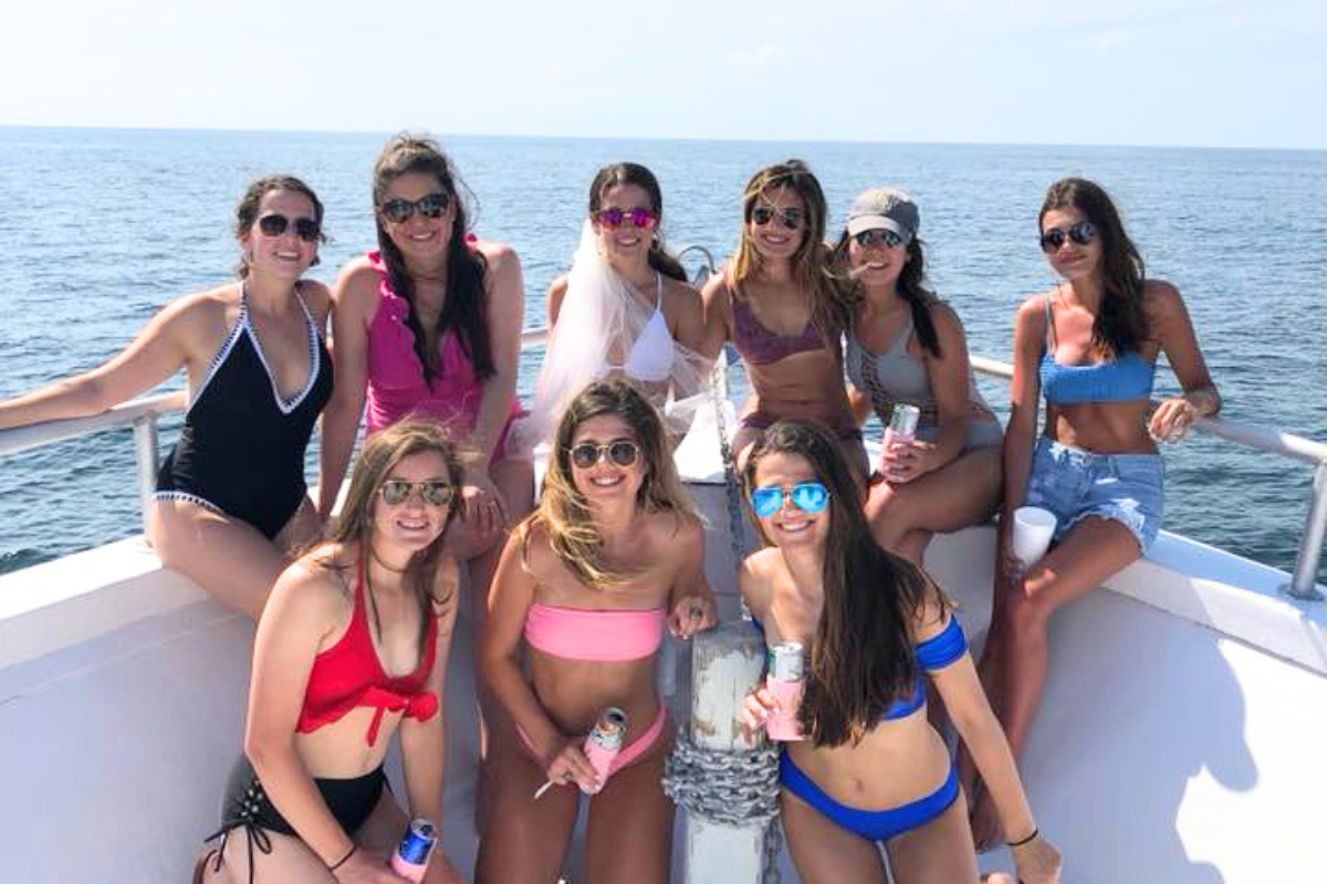 bachelorette party for large group of girls having fun on No Doubt charter boat out of Fort Morgan