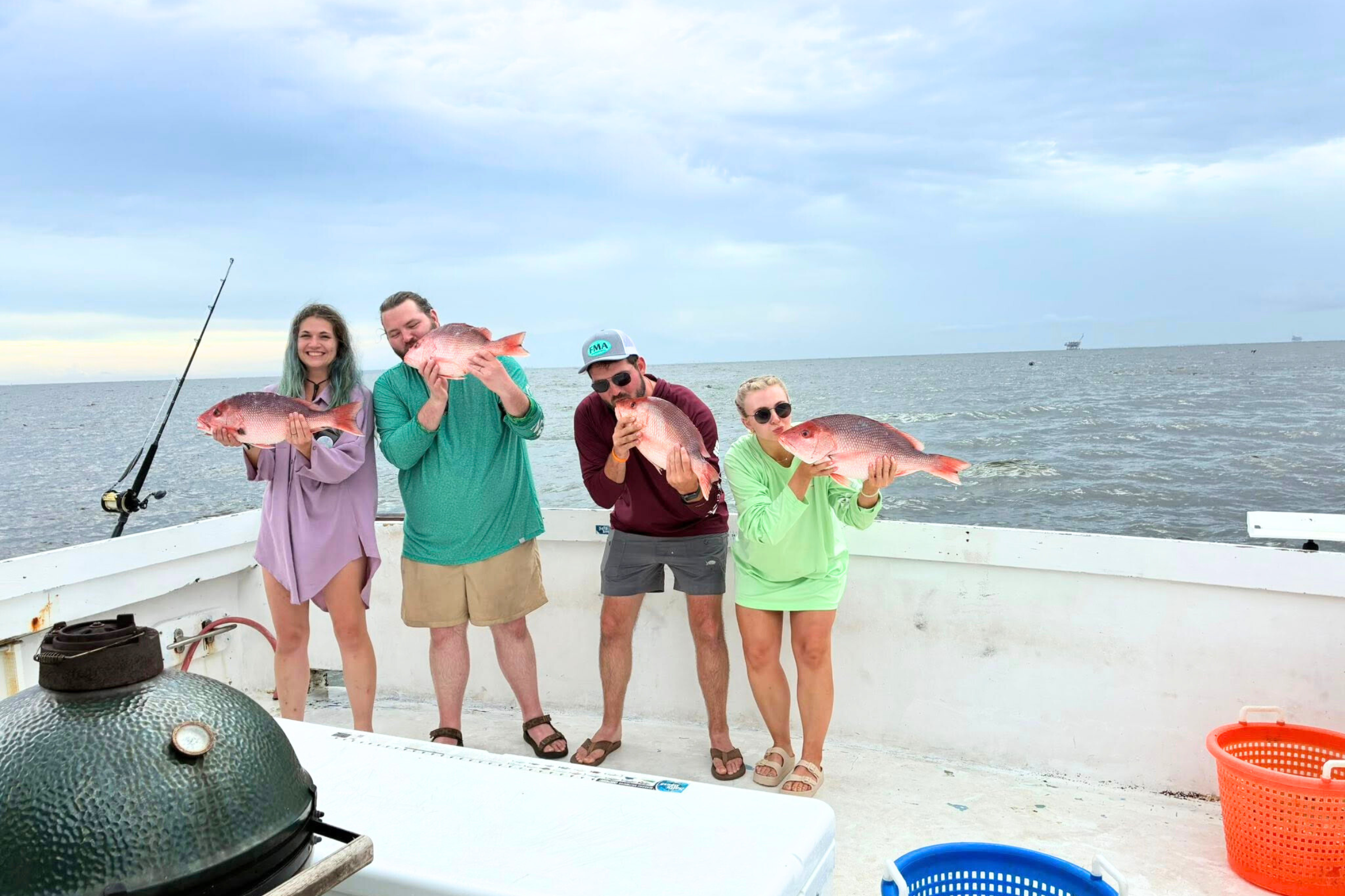 fun-loving family enjoying a day on the water aboard the no doubt out of Orange Beach / Gulf Shores, Alabama