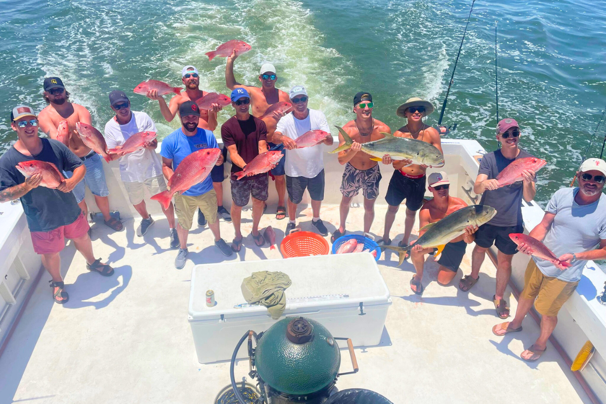 huge group of people coming back home from a successful day of offshore fishing out of fort morgan, alabama