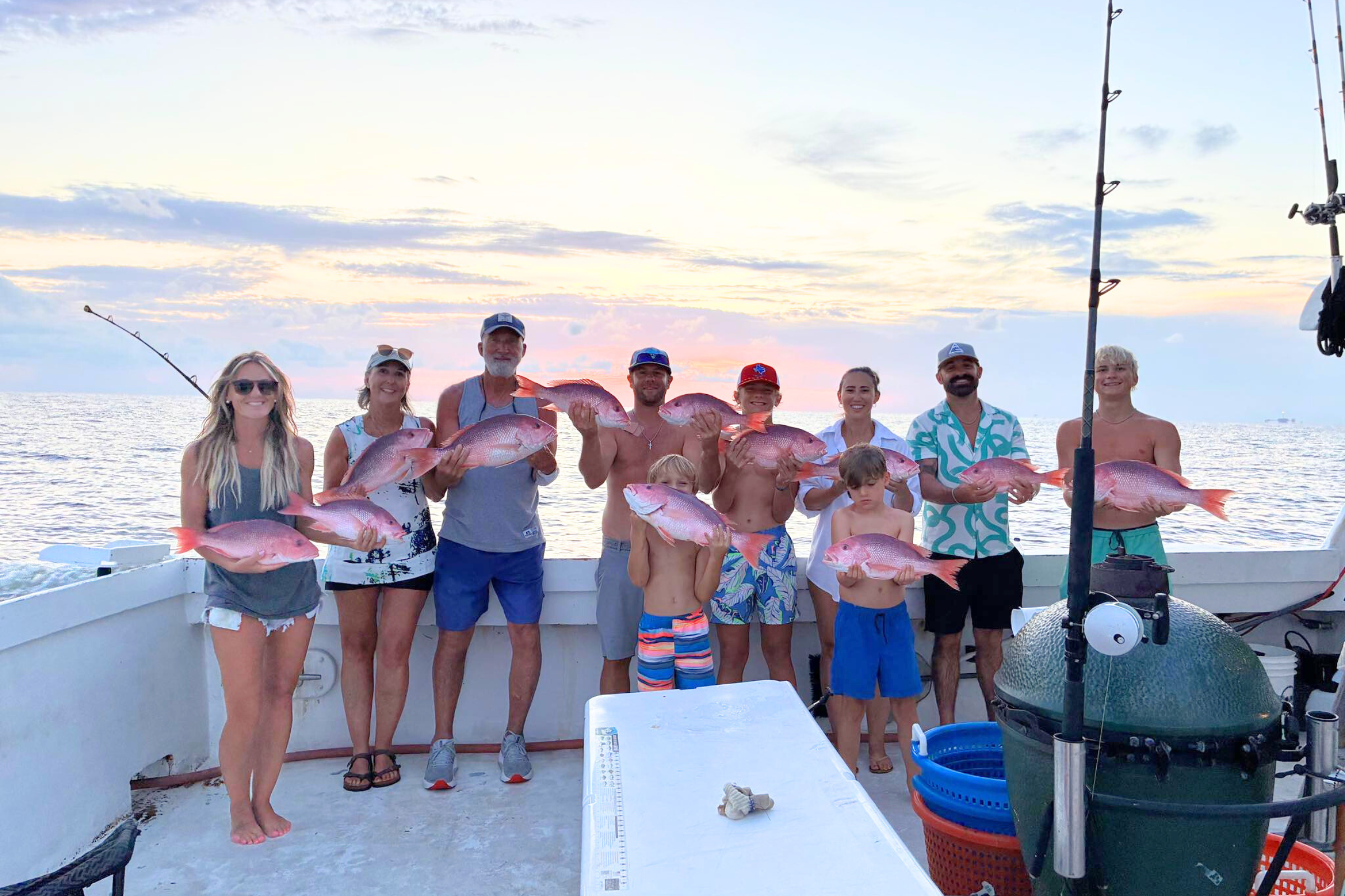 family group on a half day fishing in the Gulf of America on the way home after catching a limit of red snapper