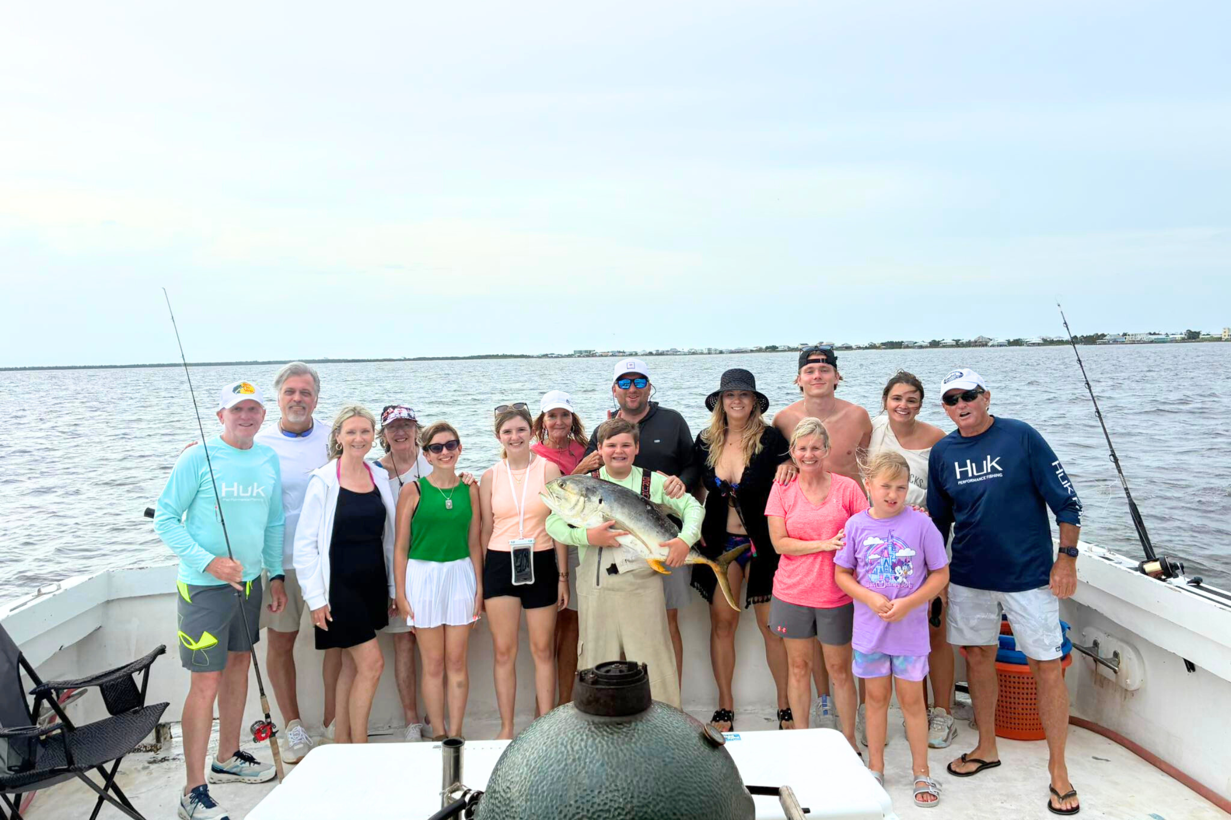 large group of family aboard offshore charter fishing boat out of Fort Morgan, Alabama