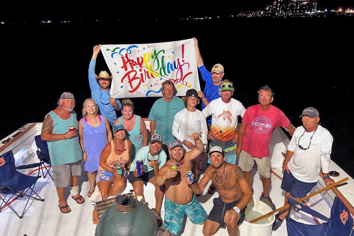birthday party of friends and family aboard no doubt fishing boat out of orange beach marina
