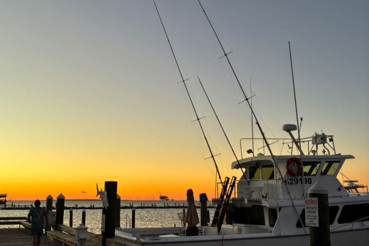 no doubt fishing boat at sunset at fort morgan marina