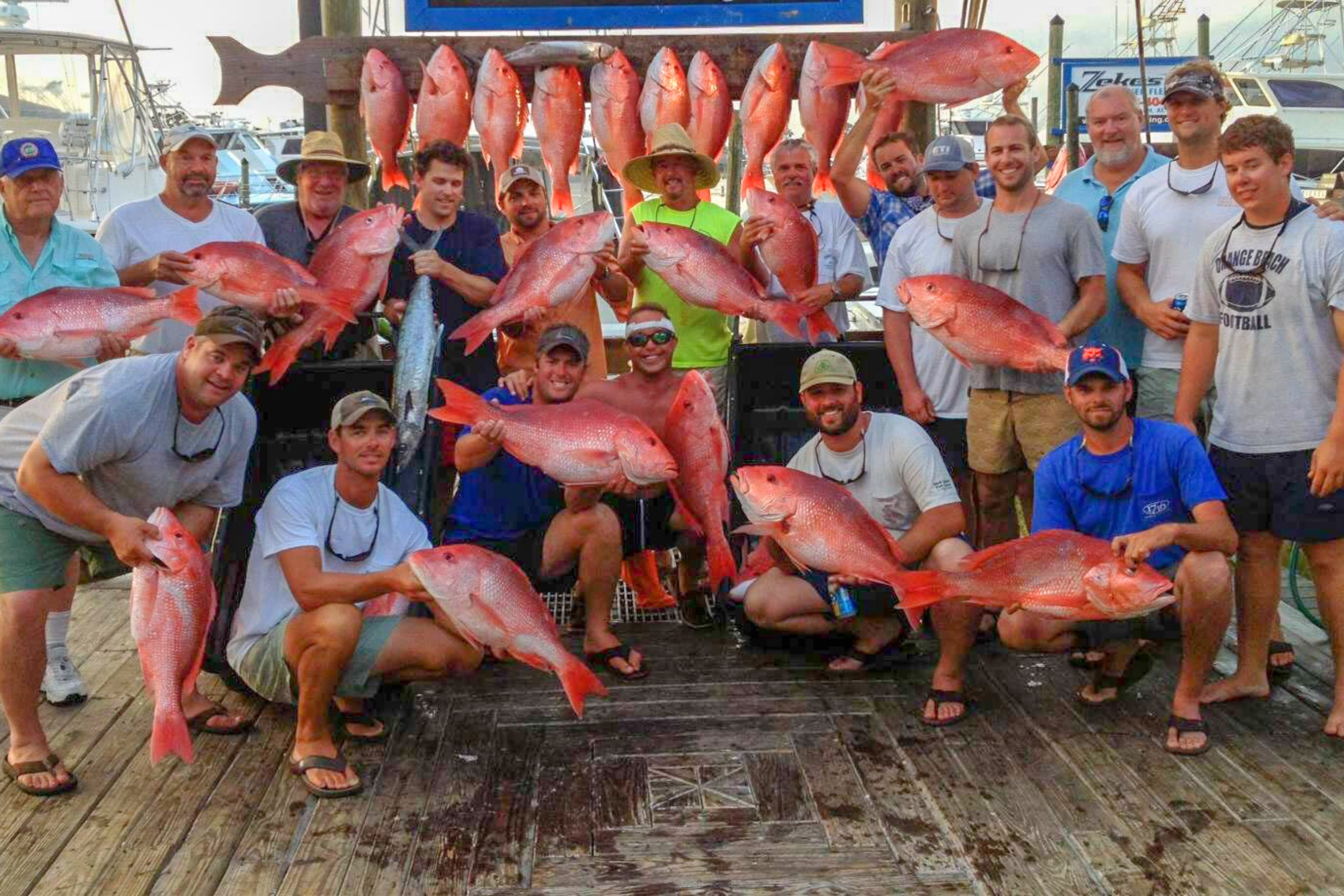 large group of guys returning from a 10 hour all day red snapper fishing trip on the Gulf of America