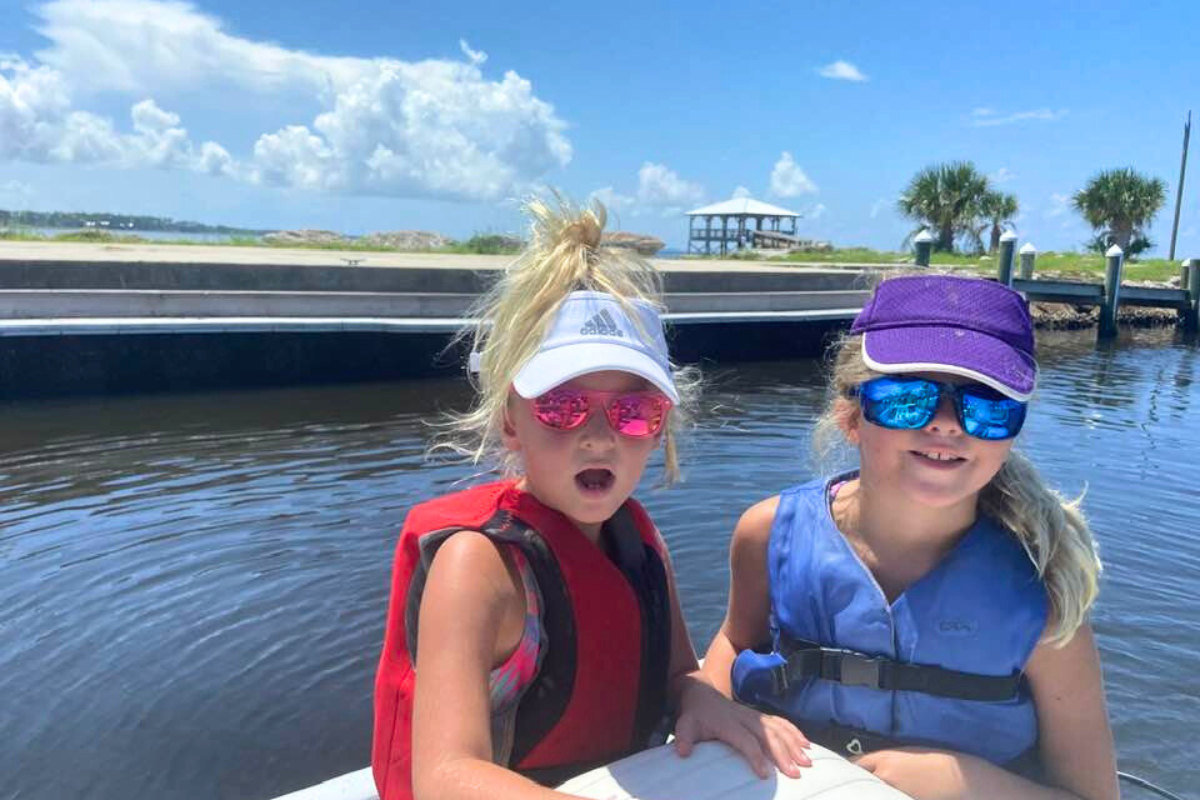 girls boating and fishing in orange beach alabama