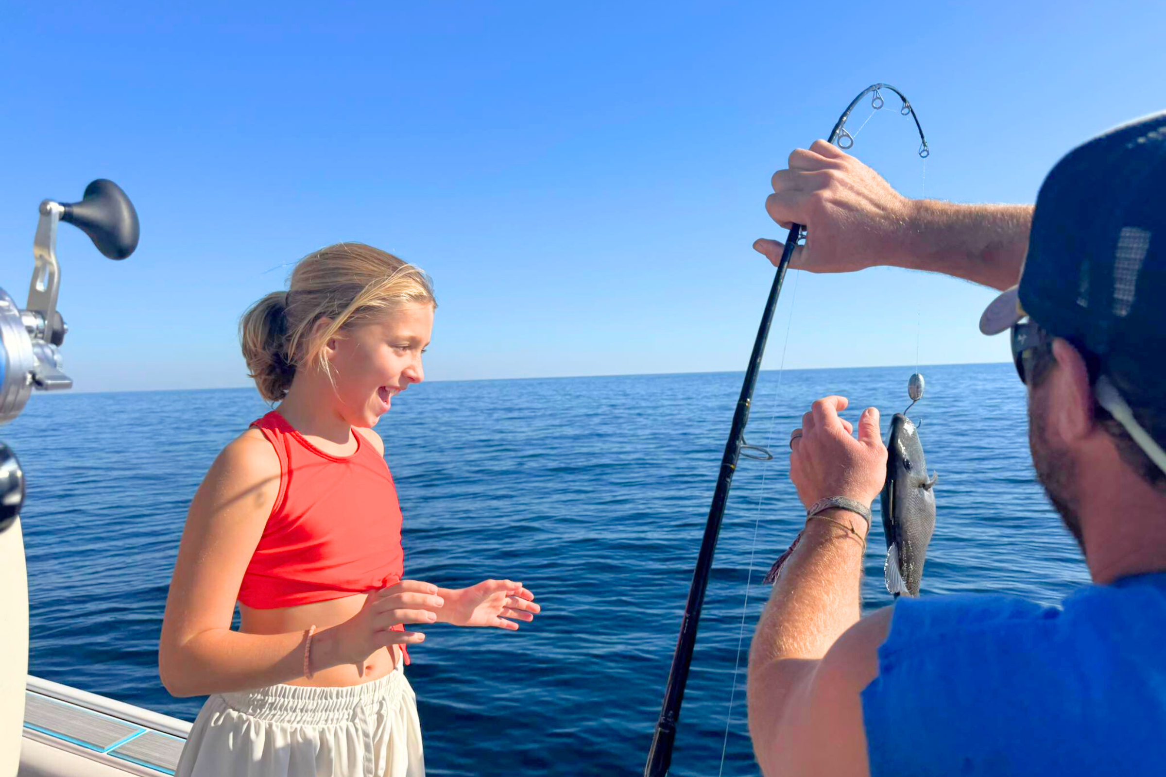 young girl red snapper fishing on the Alabama gulf coast