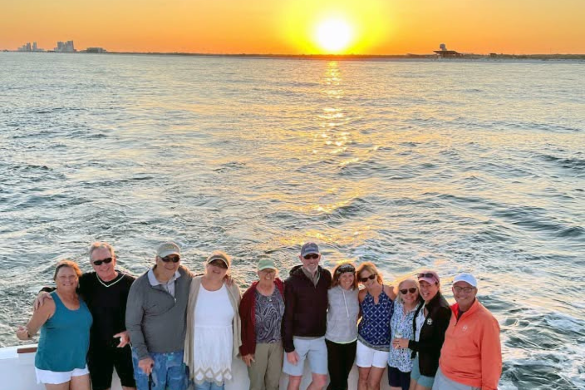 sunset on the way home from offshore fishing with large family on the No Doubt