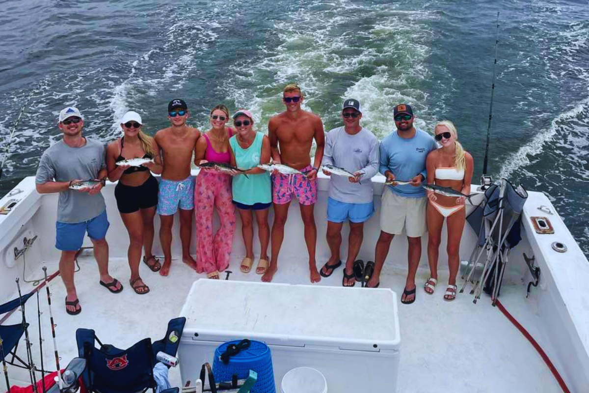 group of friends having fun on a trolling trip out of orange beach, alabama