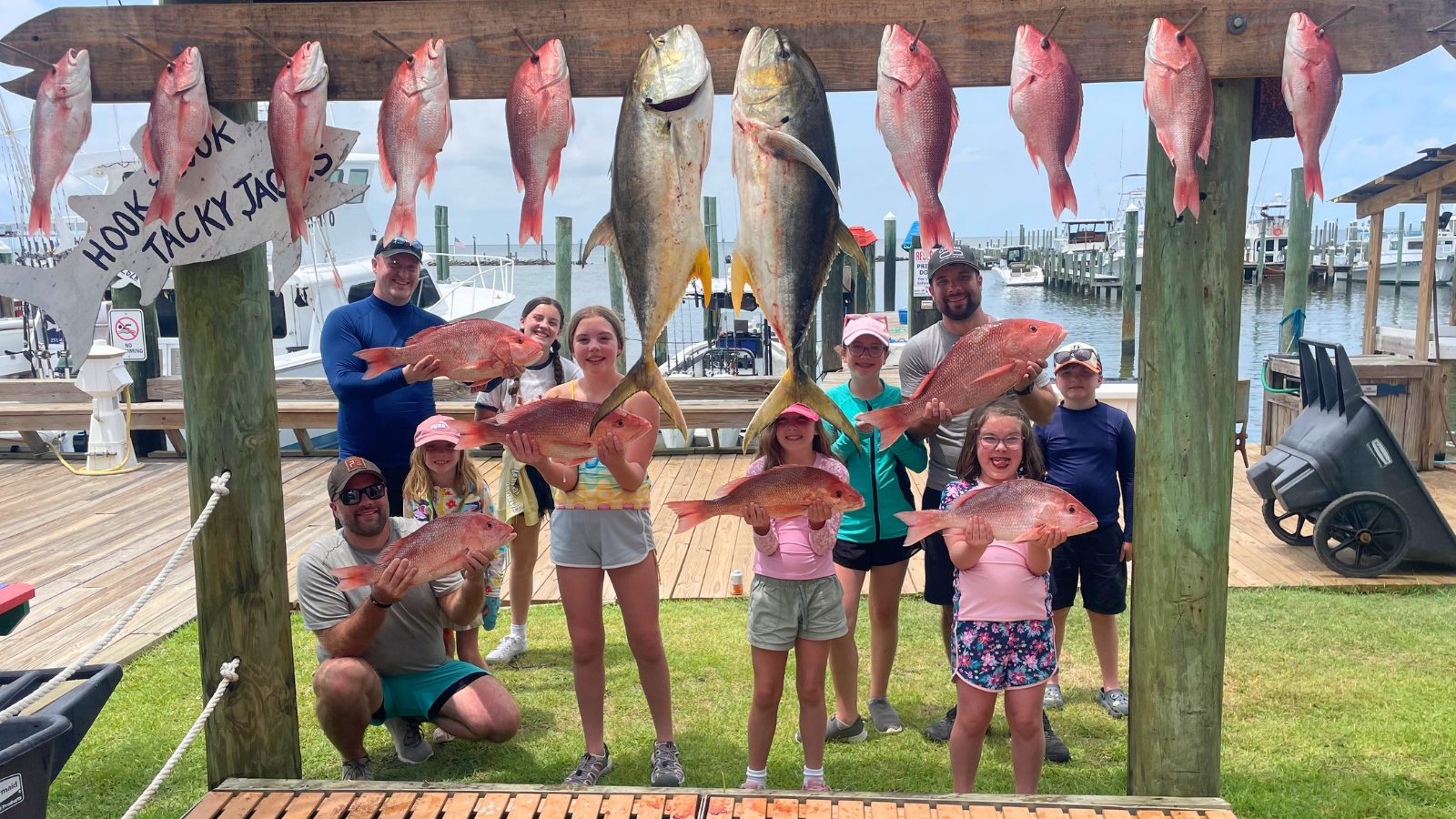 large family group with red snapper caught out of Fort Morgan Alabama on charter fishing trip