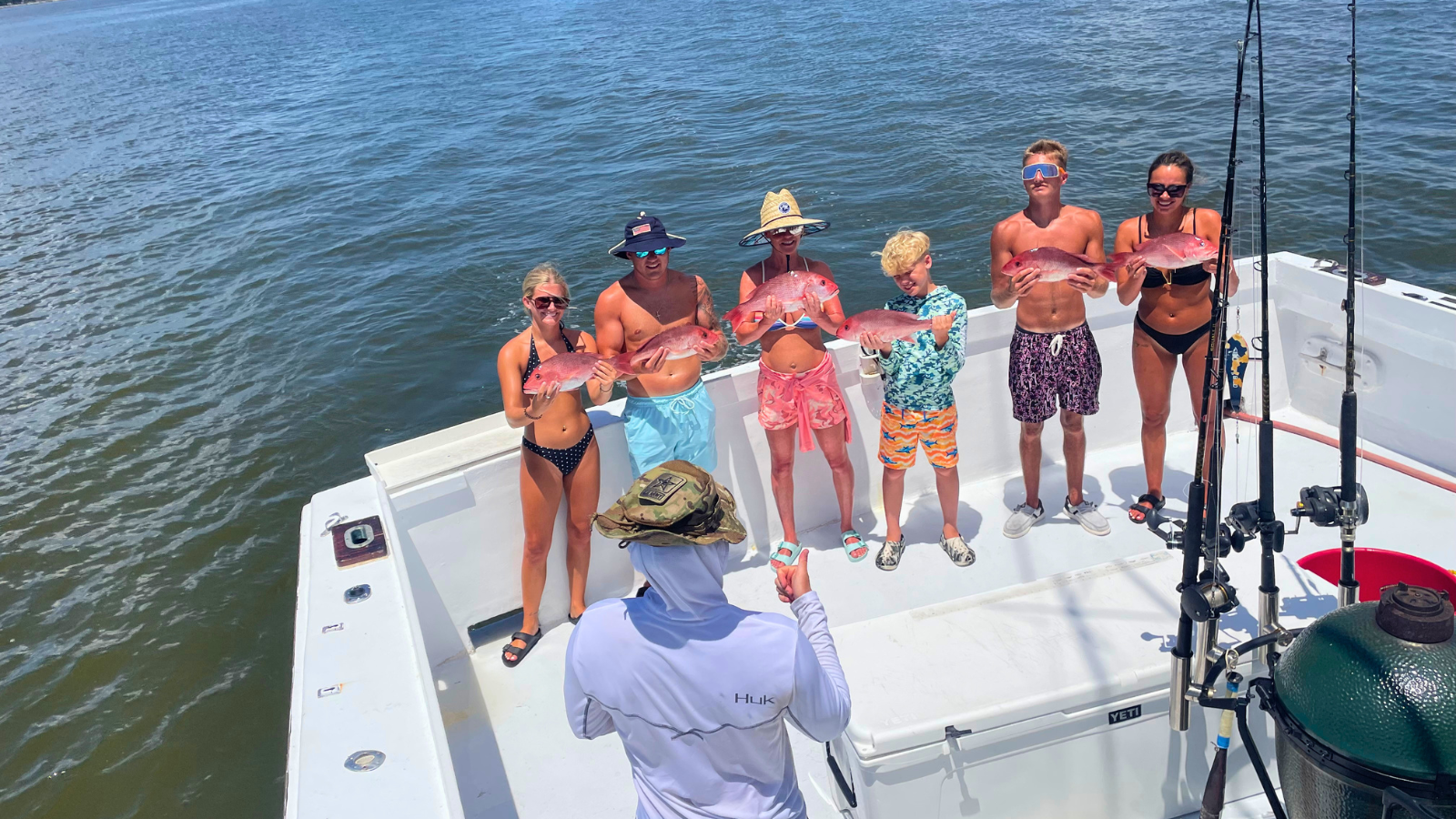 family group fishing on No Doubt private offshore fishing boat out of Fort Morgan Alabama
