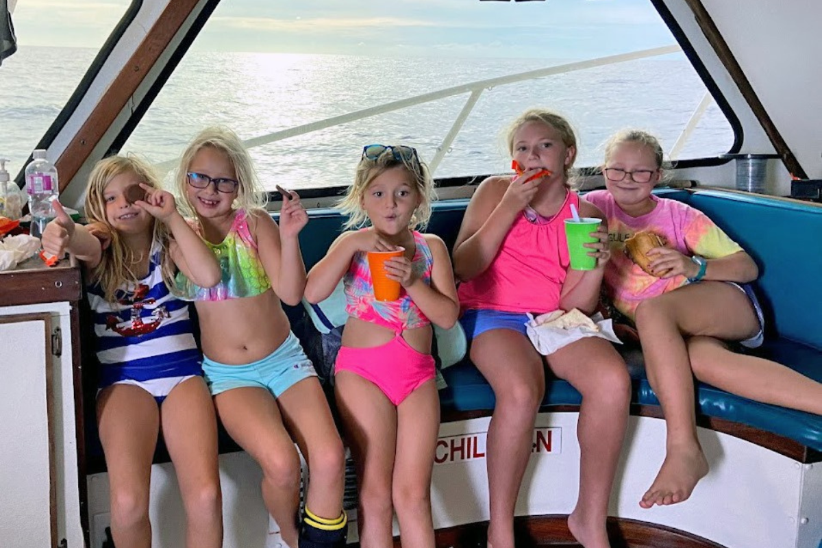 girls in cabin of private charter fishing boat on a trip out in the Gulf of America