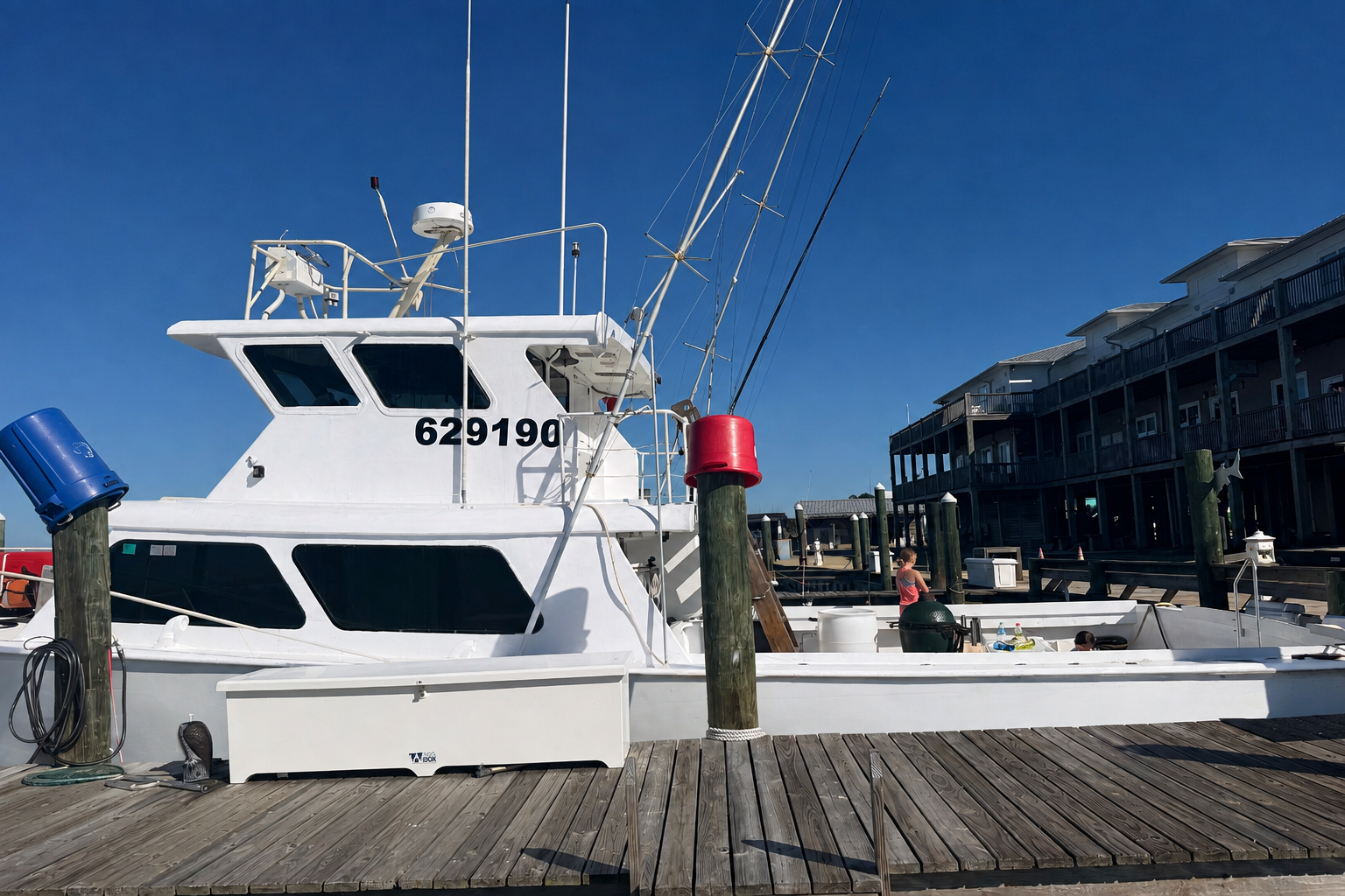 photo of a private offshore charter fishing boat - the No Doubt - docked at Fort Morgan marina